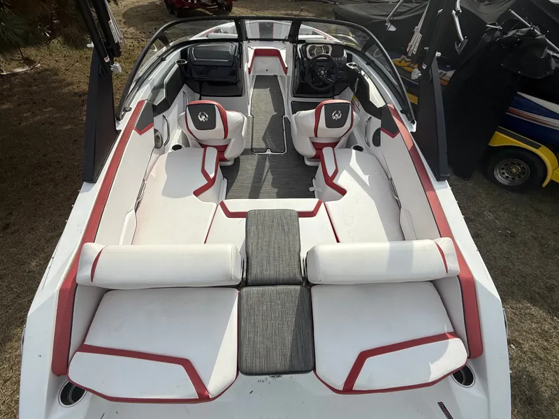 Slide: The Image of Interior of a 2021 Scarab 195 ID boat with red accents. - 4