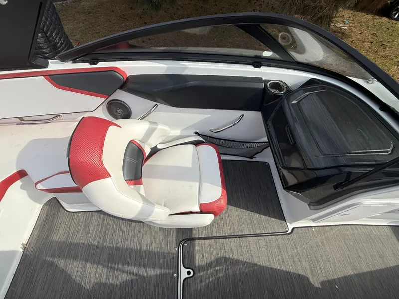 Slide: The Image of Interior of a 2021 Scarab 195 ID boat with red seating. - 7