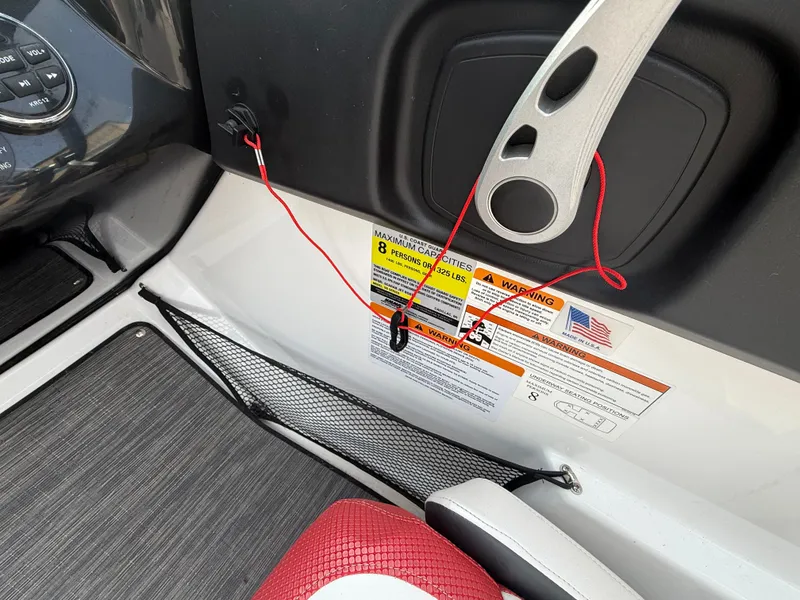 Slide: The Image of Interior of a 2021 Scarab 195 ID boat with safety warnings. - 9