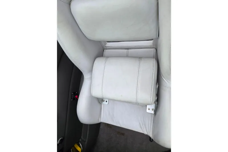 Slide: The Image of 2005 Supra Sunsport 22 V boat seat with white upholstery and visible stitching. - 11
