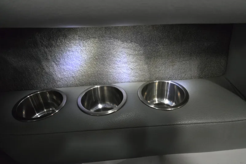 Slide: The Image of 2005 Supra Sunsport 22 V interior with stainless steel cup holders. - 7