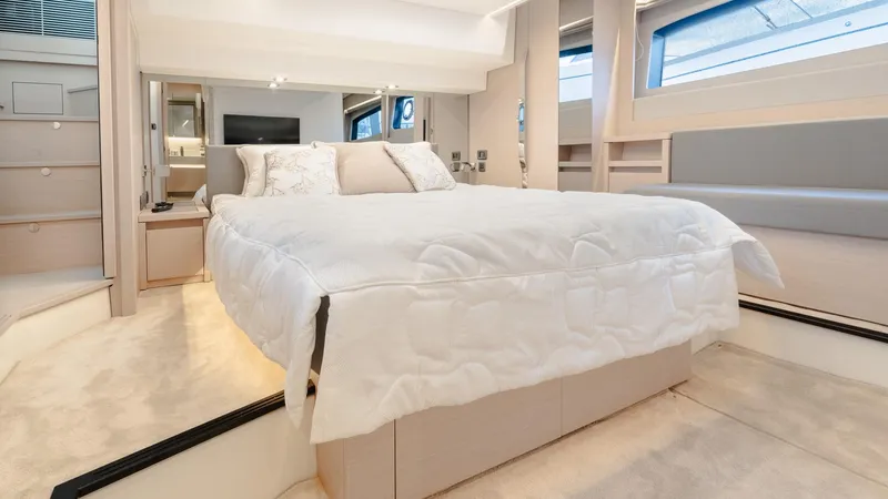 Slide: The Image of Luxurious bedroom interior of 2023 Prestige 520S yacht with elegant bedding and modern design. - 17