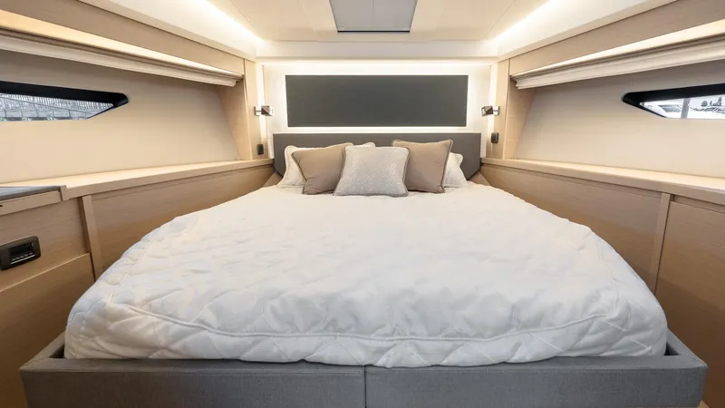 Slide: The Image of Luxurious bedroom interior of 2023 Prestige 520S yacht with elegant bedding and modern design. - 25