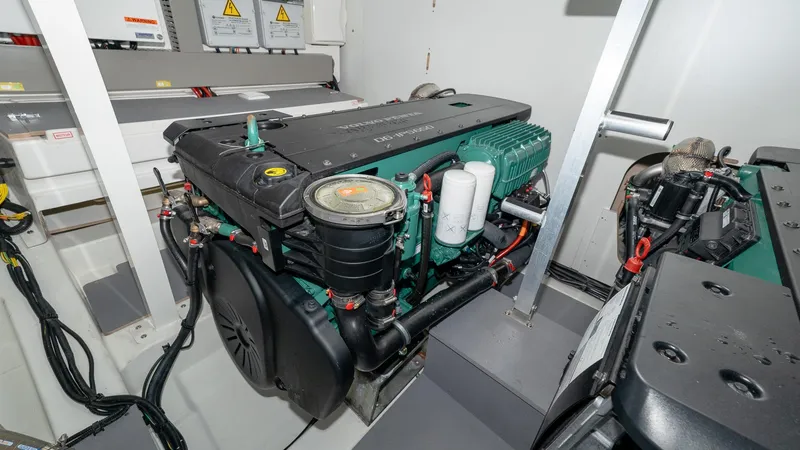 Slide: The Image of Engine room of 2023 Prestige 520S yacht, showcasing modern machinery and components. - 26