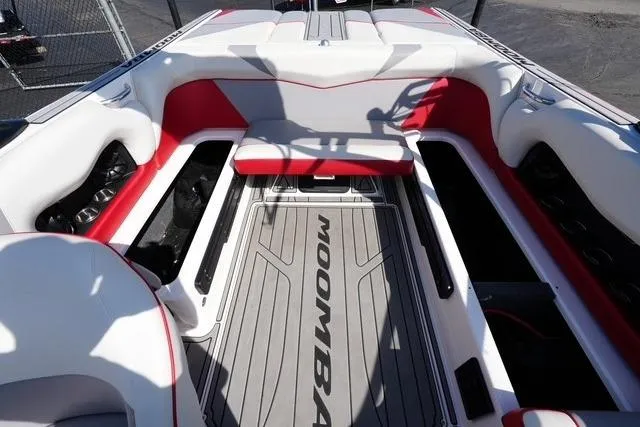 Slide: The Image of 2019 Moomba Craz boat interior with red and white seating, spacious layout. - 14