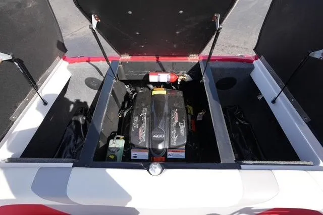 Slide: The Image of 2019 Moomba Craz boat engine compartment with open hatches and visible fire extinguisher. - 17