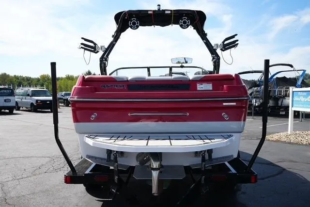 Slide: The Image of 2019 Moomba Craz boat, red and white, rear view on trailer, outdoor setting. - 5