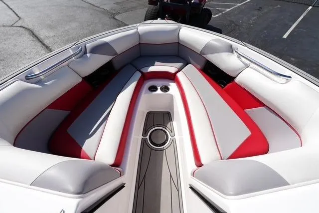 Slide: The Image of 2019 Moomba Craz boat interior with red and white seating, cup holders, and sleek design. - 7