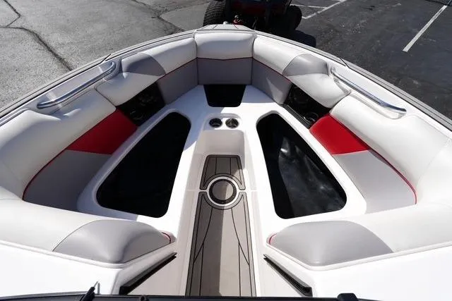 Slide: The Image of 2019 Moomba Craz boat interior with white and red seating, spacious layout. - 8