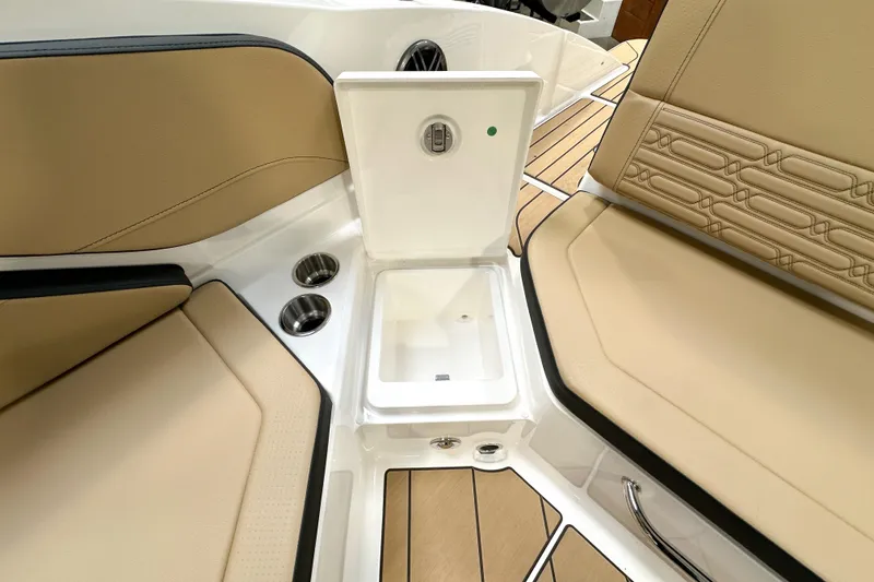 Slide: The Image of Interior of 2026 Sea Ray SPX 210 boat with beige seating and storage compartment. - 14