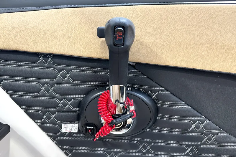 Slide: The Image of Throttle control of 2026 Sea Ray SPX 210 boat with red safety lanyard. - 17