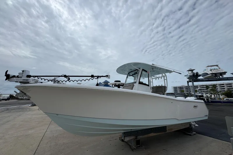 Slide: The Image of 2024 Sea Hunt Gamefish 28 boat on display under cloudy sky. - 1