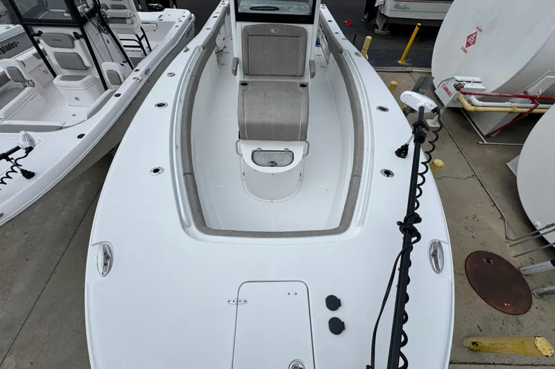 Slide: The Image of 2024 Sea Hunt Gamefish 28 boat, white deck, seating, and fishing equipment. - 19
