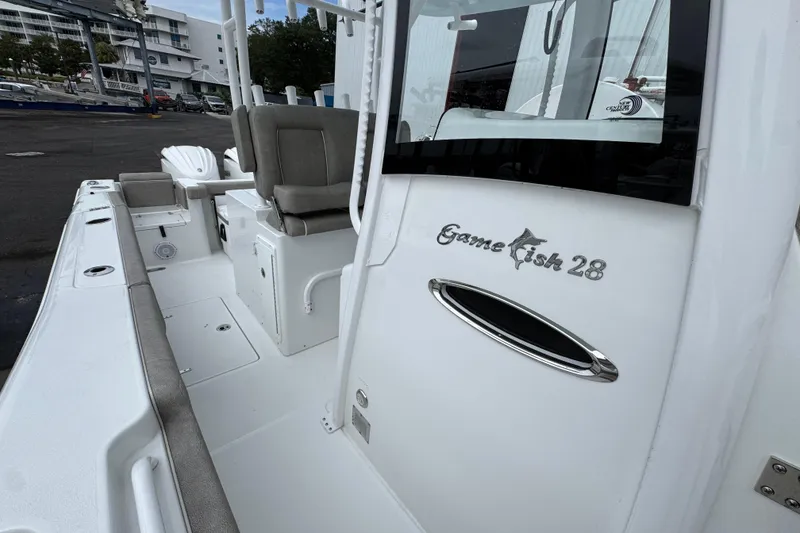 Slide: The Image of 2024 Sea Hunt Gamefish 28 boat interior with seating and storage compartments. - 23