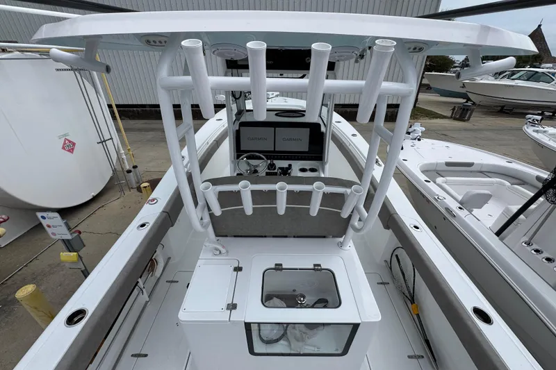 Slide: The Image of 2024 Sea Hunt Gamefish 28 boat interior with rod holders and Garmin electronics. - 34