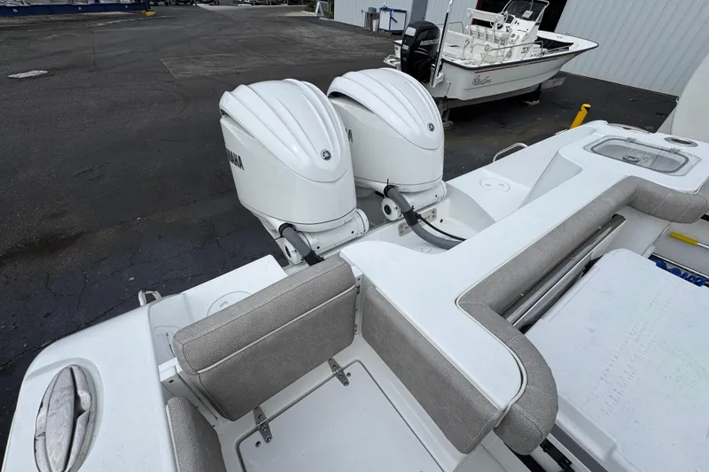 Slide: The Image of 2024 Sea Hunt Gamefish 28 with dual Yamaha outboard engines, rear seating, and fishing amenities. - 39