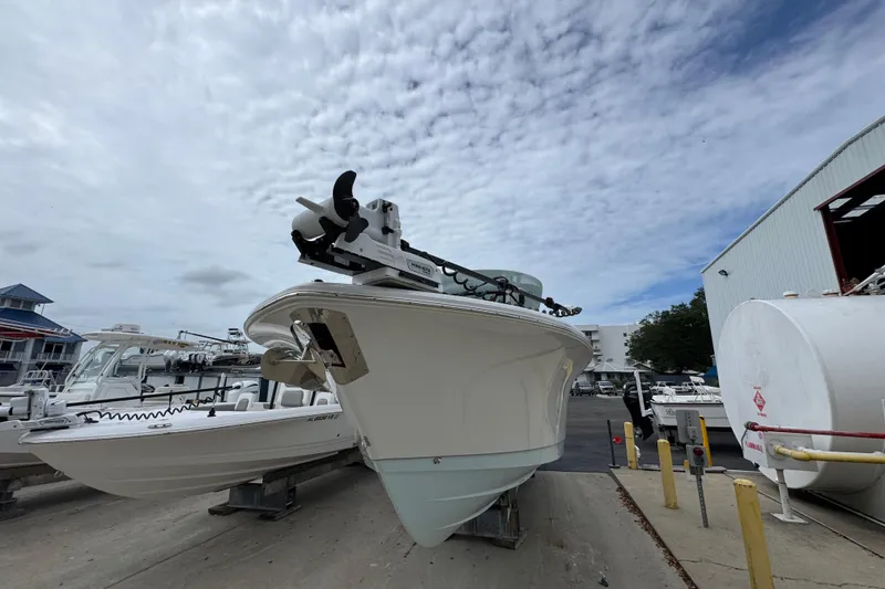 Slide: The Image of 2024 Sea Hunt Gamefish 28 boat docked under cloudy sky. - 4
