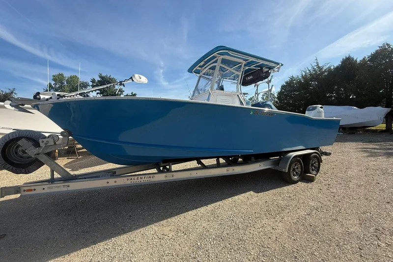 The Image of Blue 2020 Valentino 28CC boat on trailer under clear sky. - 0