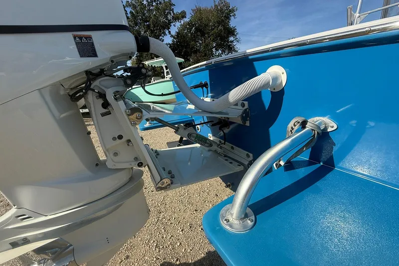 Slide: The Image of Valentino 28CC 2020 boat engine and ladder detail, featuring blue hull and metal fittings. - 10