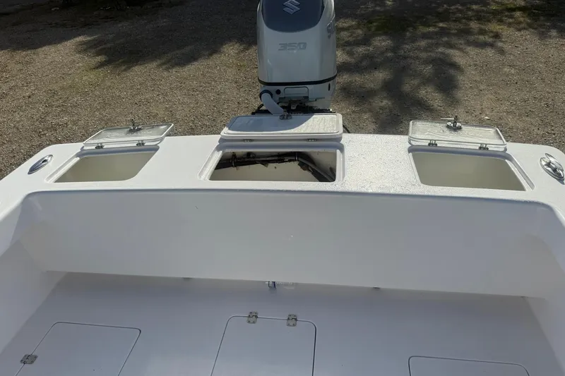 Slide: The Image of 2020 Valentino 28CC boat with Suzuki 350 engine, featuring storage compartments. - 16