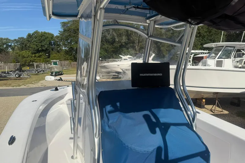 Slide: The Image of 2020 Valentino 28CC boat with Humminbird electronics, parked outdoors. - 21