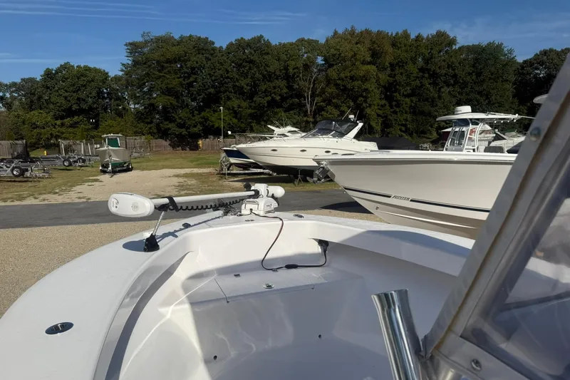 Slide: The Image of Valentino 28CC boat, 2020 model, docked with other boats in a marina setting. - 22