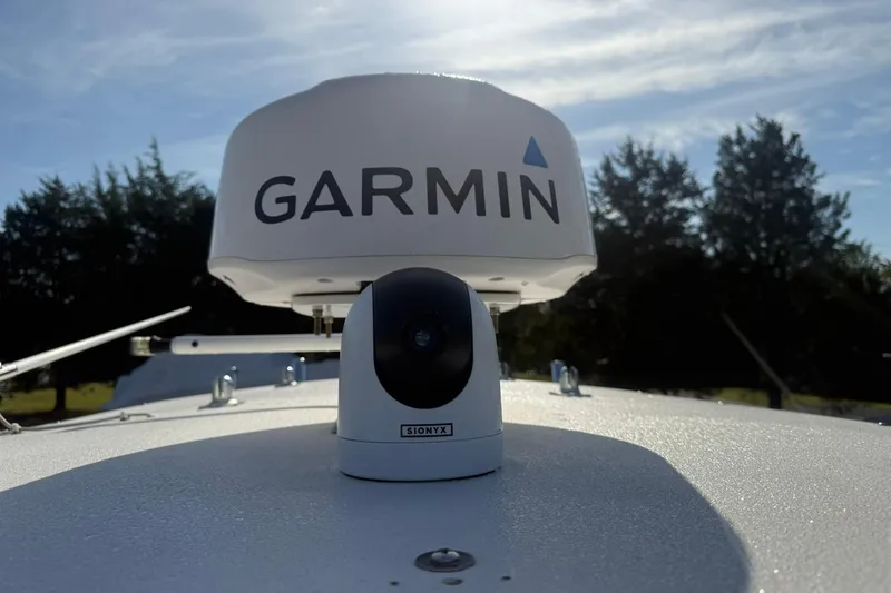 Slide: The Image of Garmin radar on Valentino 28CC boat, 2020 model, under clear sky. - 31