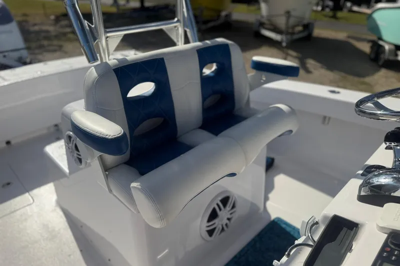 Slide: The Image of Valentino 28CC 2020 boat interior with blue and white seating and steering wheel. - 34