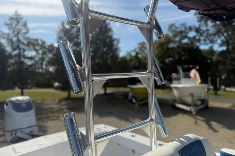 Slide: The Image of Valentino 28CC boat ladder with rod holders, 2020 model, in a sunny outdoor setting. - 36
