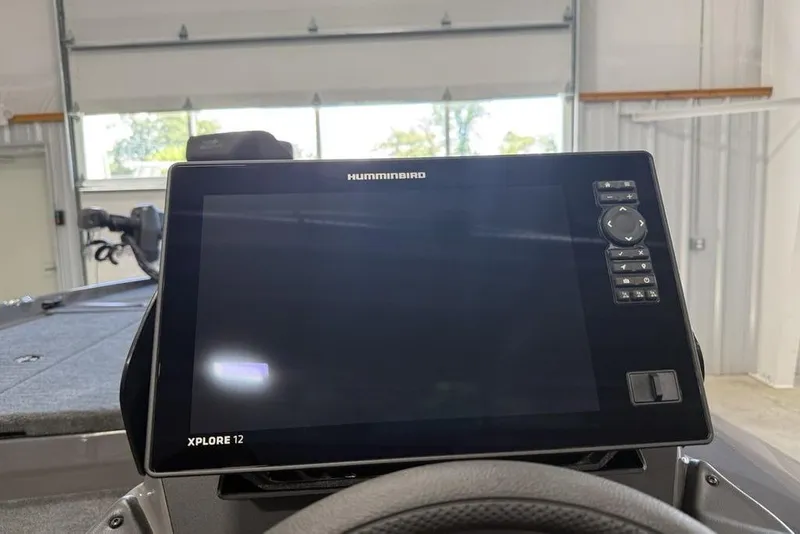 Slide: The Image of Humminbird Xplore 12 display on 2025 Skeeter ZXR20 boat dashboard in a garage. - 13