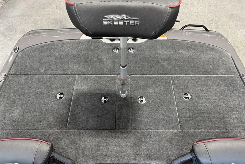 Slide: The Image of 2025 Skeeter ZXR20 boat deck with seat, featuring gray carpeting and sleek design. - 16