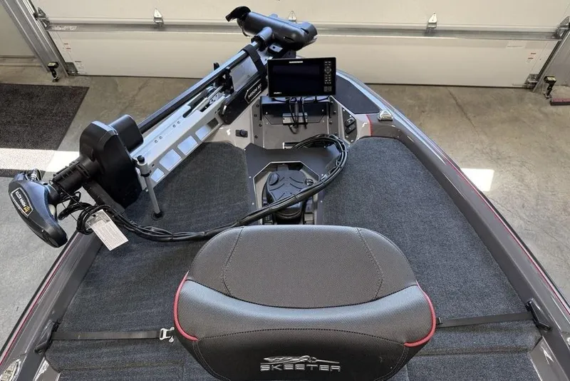 Slide: The Image of 2025 Skeeter ZXR20 boat interior with advanced navigation system and comfortable seating. - 2