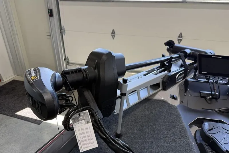 Slide: The Image of 2025 Skeeter ZXR20 boat with advanced trolling motor and navigation system in a garage. - 5