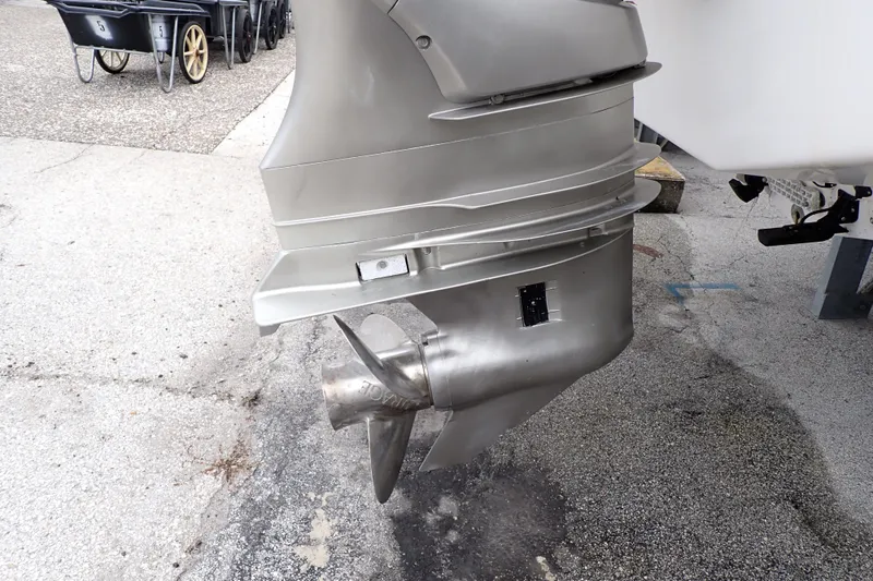 Slide: The Image of 2002 Pro-Line 33 WA boat propeller and outboard motor close-up. - 103