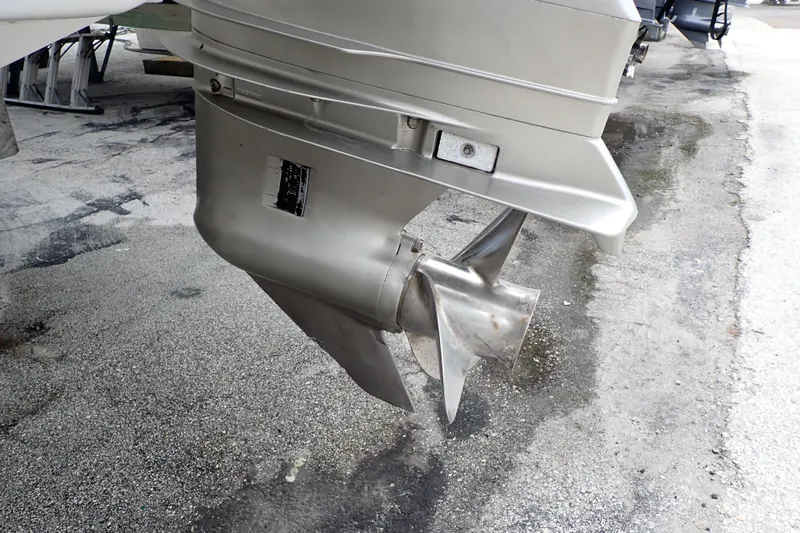 Slide: The Image of 2002 Pro-Line 33 WA boat propeller on a concrete surface. - 107