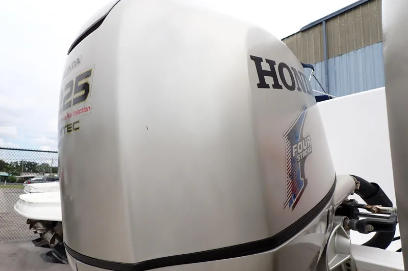 Slide: The Image of Honda 225 outboard motor on 2002 Pro-Line 33 WA boat, four-stroke engine. - 108