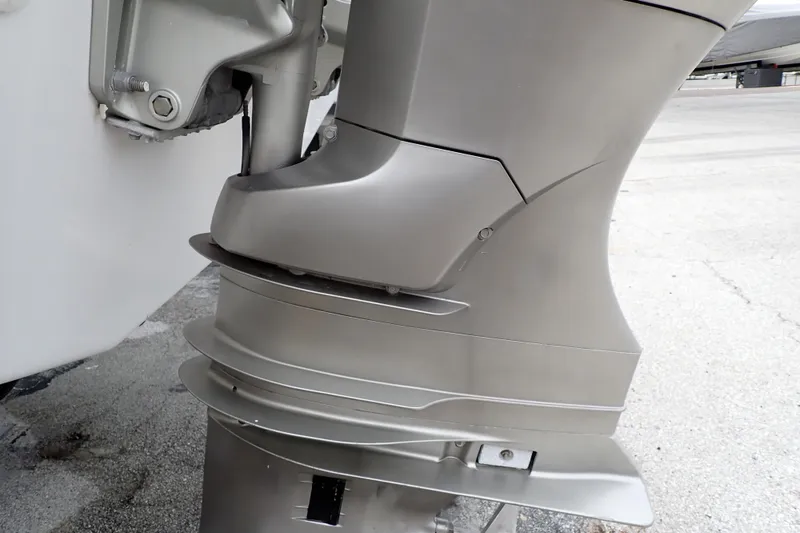 Slide: The Image of 2002 Pro-Line 33 WA boat engine close-up, showcasing sleek metallic design. - 114