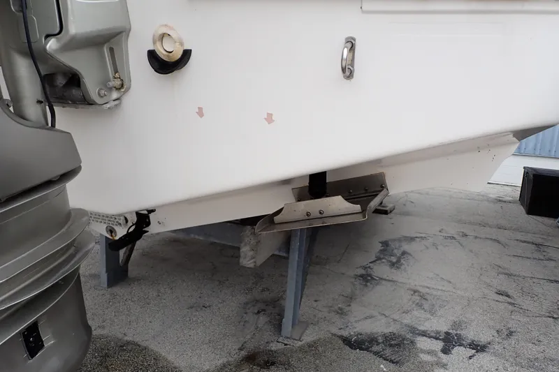 Slide: The Image of 2002 Pro-Line 33 WA boat hull and outboard motor detail. - 120