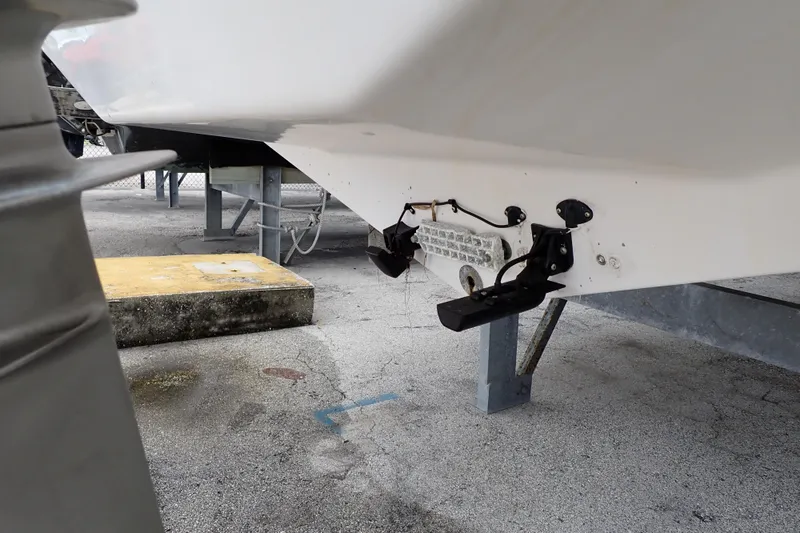 Slide: The Image of 2002 Pro-Line 33 WA boat hull on trailer, showing underside and transom details. - 121