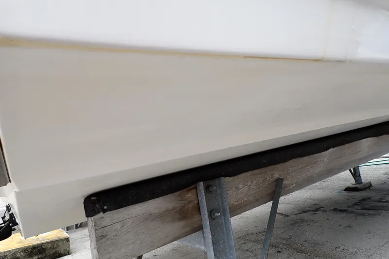 Slide: The Image of 2002 Pro-Line 33 WA boat hull on a support stand. - 122