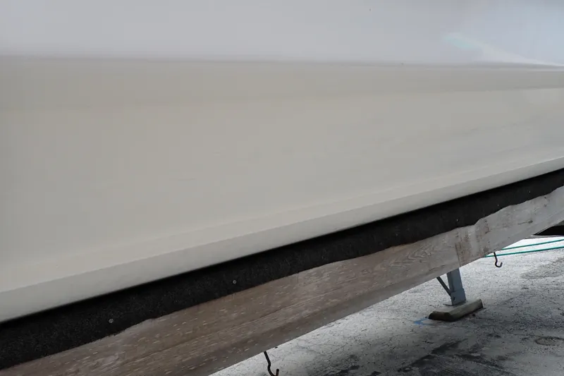 Slide: The Image of 2002 Pro-Line 33 WA boat hull on a trailer, side view. - 123