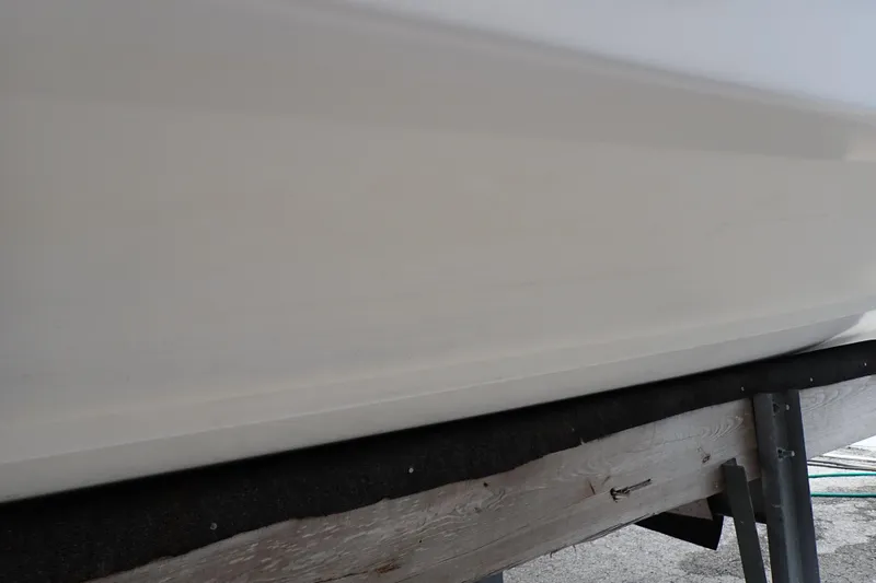 Slide: The Image of Close-up of 2002 Pro-Line 33 WA boat hull on a trailer. - 124