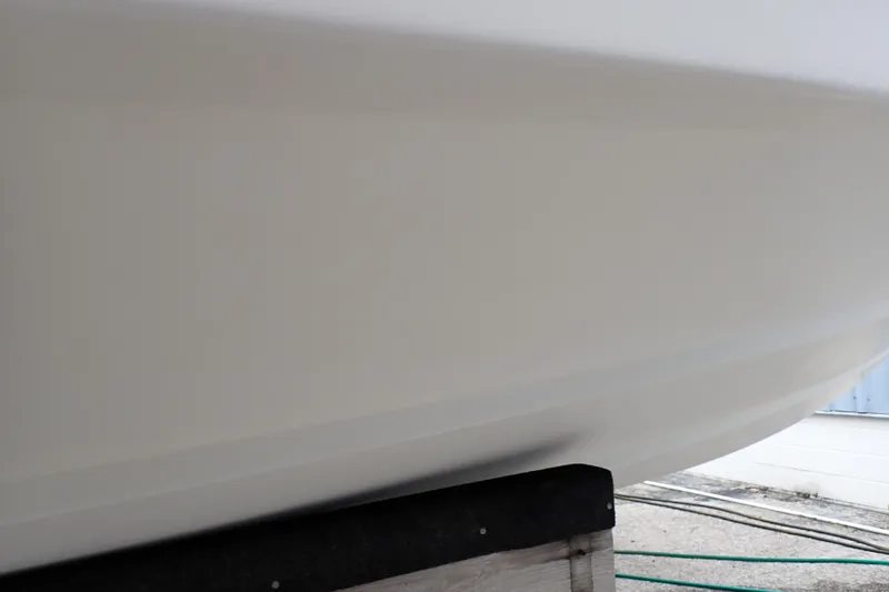 Slide: The Image of Close-up of 2002 Pro-Line 33 WA boat hull on a stand. - 125