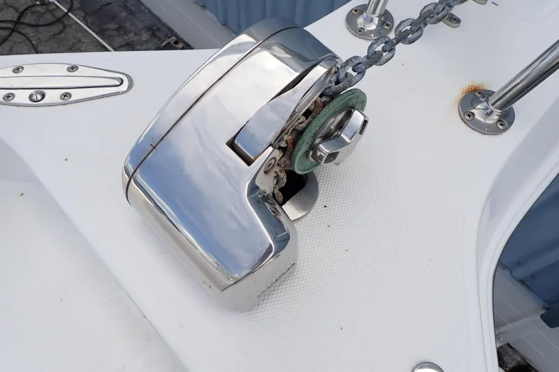 Slide: The Image of Anchor windlass on 2002 Pro-Line 33 WA boat deck. - 14