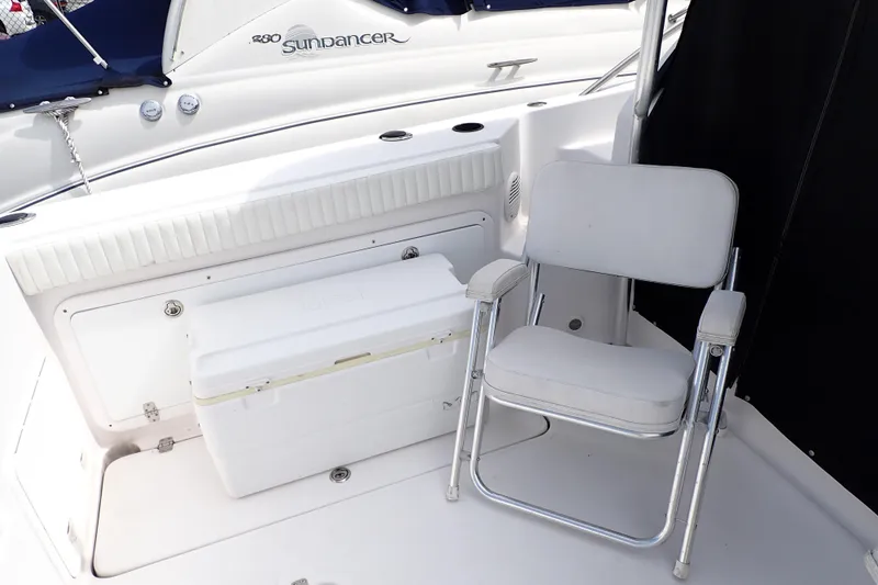Slide: The Image of 2002 Pro-Line 33 WA boat interior with white chair and cooler. - 15