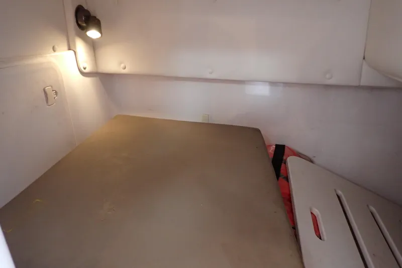 Slide: The Image of 2002 Pro-Line 33 WA cabin interior with bed and wall light. - 28