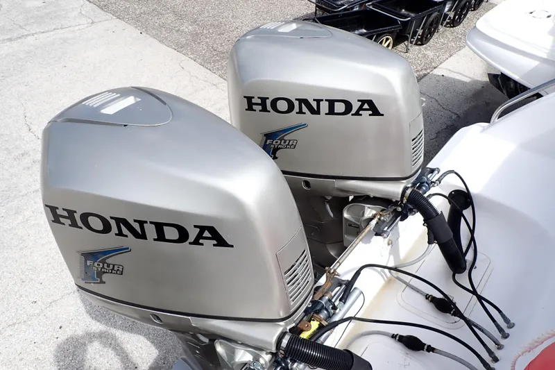 Slide: The Image of Twin Honda outboard motors on a 2002 Pro-Line 33 WA boat. - 3