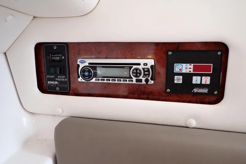 Slide: The Image of 2002 Pro-Line 33 WA control panel with Kohler power system and air conditioning controls. - 31