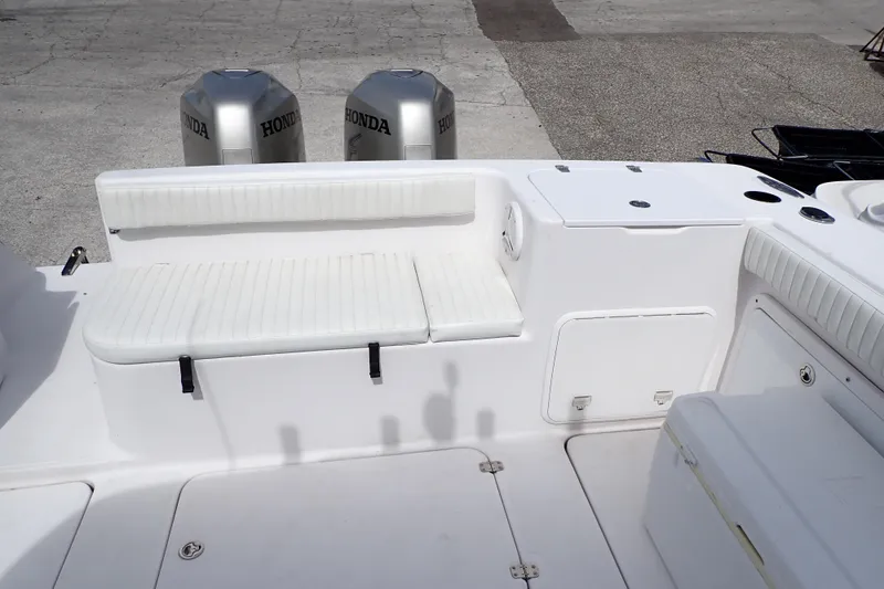 Slide: The Image of 2002 Pro-Line 33 WA boat interior with Honda outboard motors and white seating. - 5