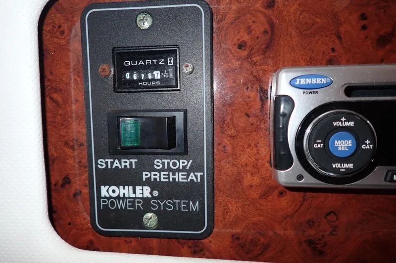 Slide: The Image of Control panel of a 2002 Pro-Line 33 WA boat with Kohler power system. - 82